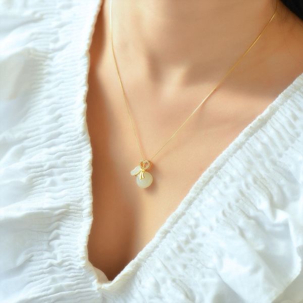 Mặt dây chuyền hình túi tiền bằng vàng